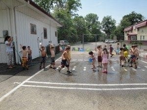 Outside play with water at summer camp