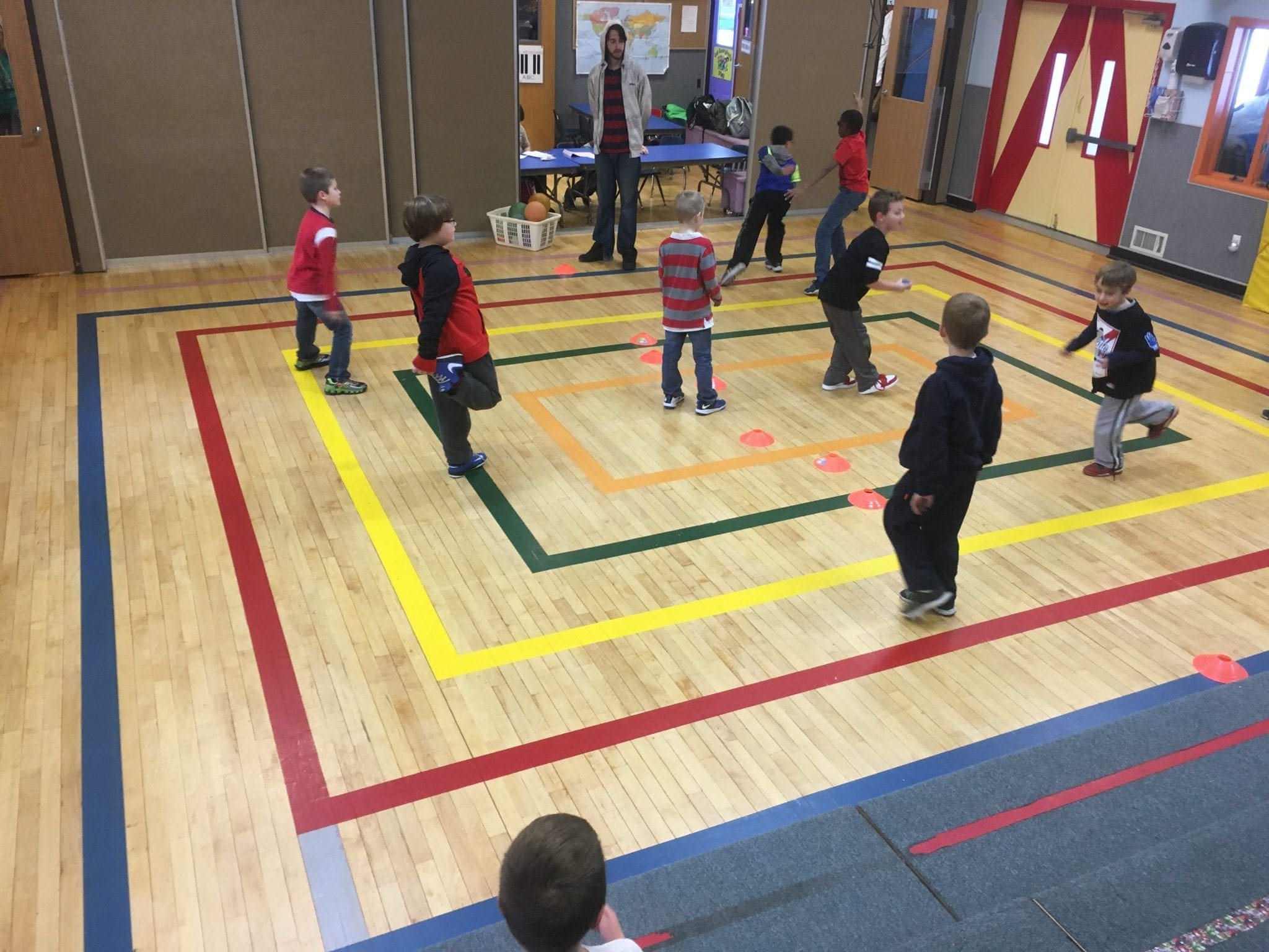 kids playing in the gym at stay and play club after school program