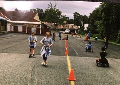 tom thumb "catch Us if you Can" summer camp - kids riding scooters