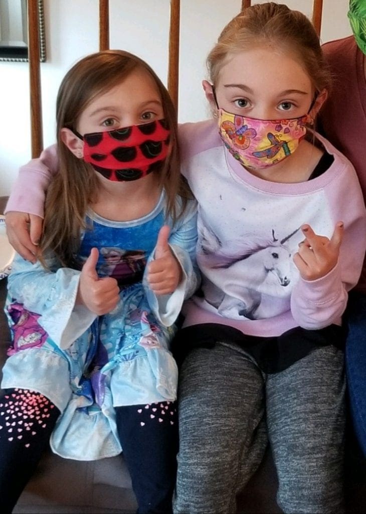 Adelyn and Aubree wearing their masks